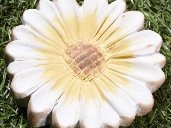 Colored ceramic decoration with feathers to hang