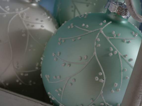 Glass ball with decorations to hang on display