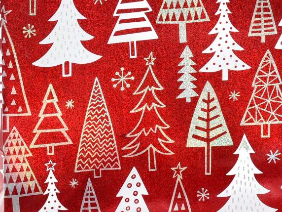 Metallic paper bag with Christmas decorations and satin hand