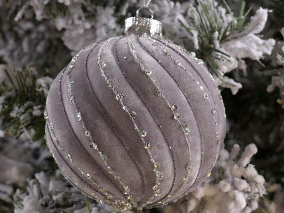 Gray velvet ball with glitter decorations in display