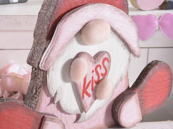 Gnome in love with a pink heart to rest
