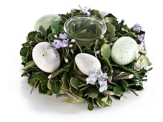 Centro de mesa con huevo y flores y portavelas de cristal