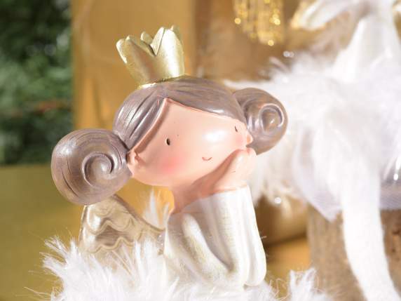 Long legged resin angel with feather skirt to lean on