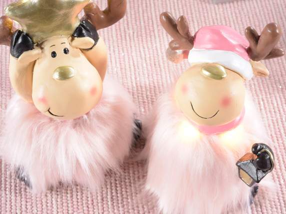 Resin reindeer with golden details, eco-fur skirt and LED