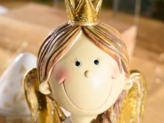 Resin angel with eco-fur skirt and golden wings with LED lig