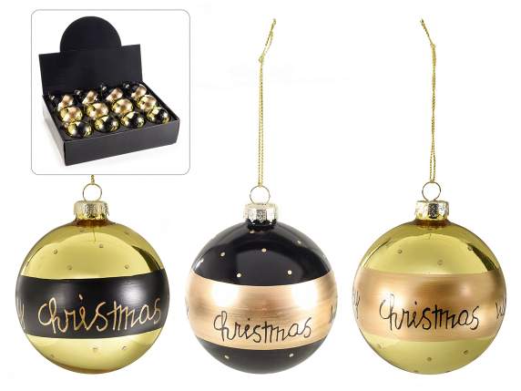Colored glass ball with golden glitter decorations on displa