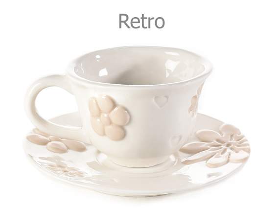 Porcelain cup and saucer with embossed flower decorations