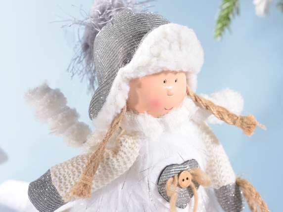 Resin girl w - eco-fur dresses on wooden sled