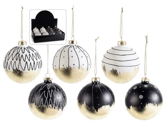 Glass ball to hang with shiny gold-like decorations on displ