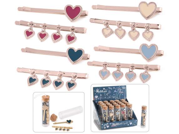Set of 2 enameled heart hair clips, rose gold color on displ