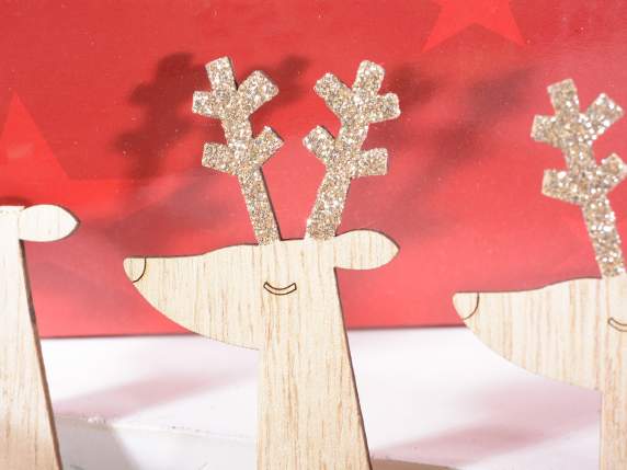 Wooden reindeer with colored ribbon