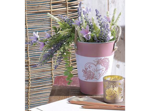 Metal vase with rope handles and heart decoration