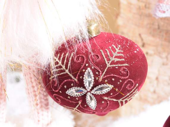 Burgundy velvet ball with glitter decorations in display