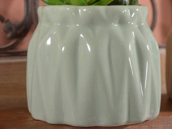 Colored glossy ceramic pot with artificial seedling