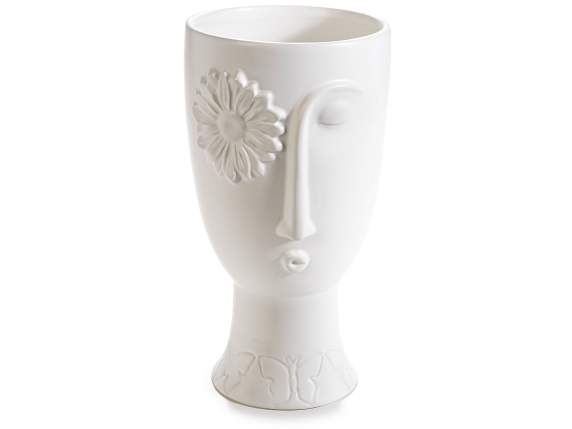 Opaque porcelain vase with face in relief