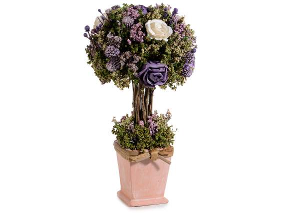 Small tree in a pot with roses, artificial flowers and a bow