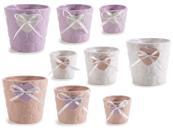 Set of 3 ceramic vases with embossed decorations and applied