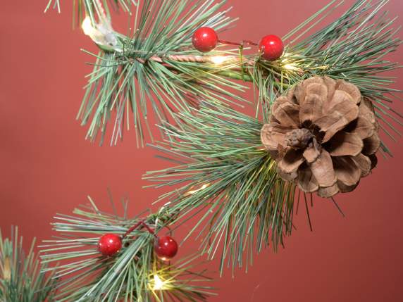 Christmas decoration on wooden base with pine cones and LED