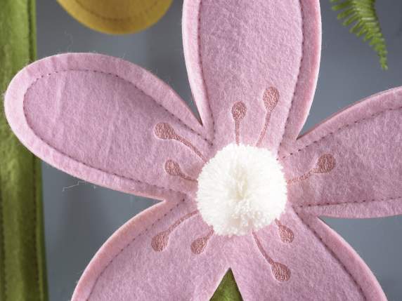 Set of 3 decorative flowers in colored cloth on a wooden bas
