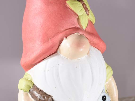 Gnome in colored terracotta with a butterfly on his hat