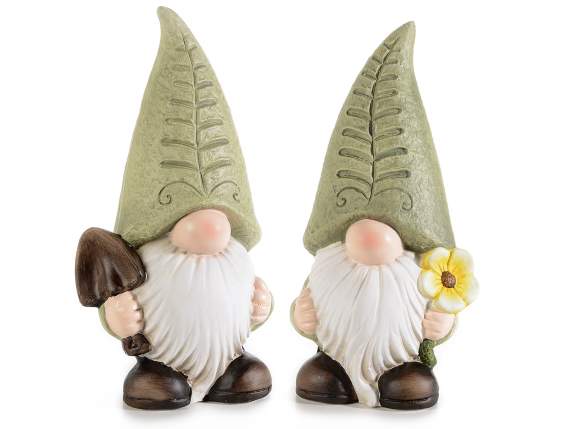 Gnome in colored terracotta with flower and shovel in hand