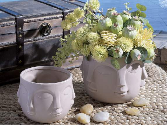 Set of 3 natural colored ceramic vases with face decoration
