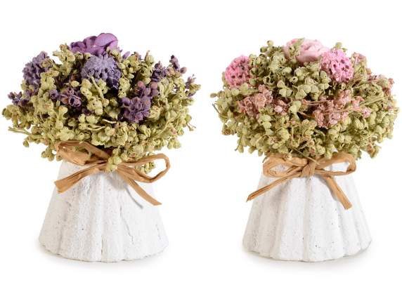 Vase with flowers, artificial roses and raffia bow
