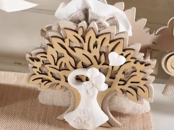 Wooden tree of life with plaster couple and bag