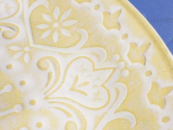 Decorative wooden plate with relief decorations